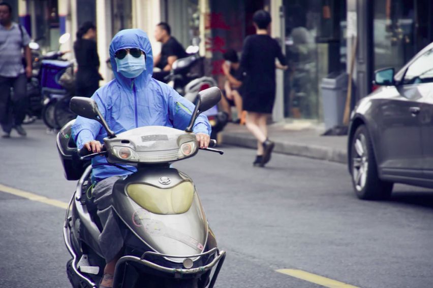 A person driving scooter