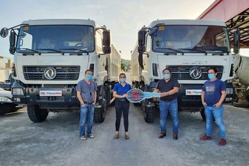 Tacloban construction firm gets 4 Dongfeng dump trucks