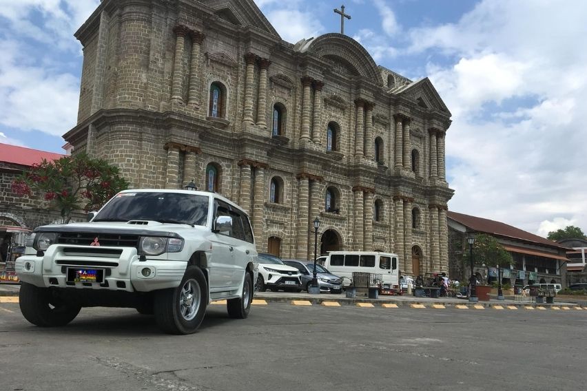 Mitsubishi Pajero in front of Church