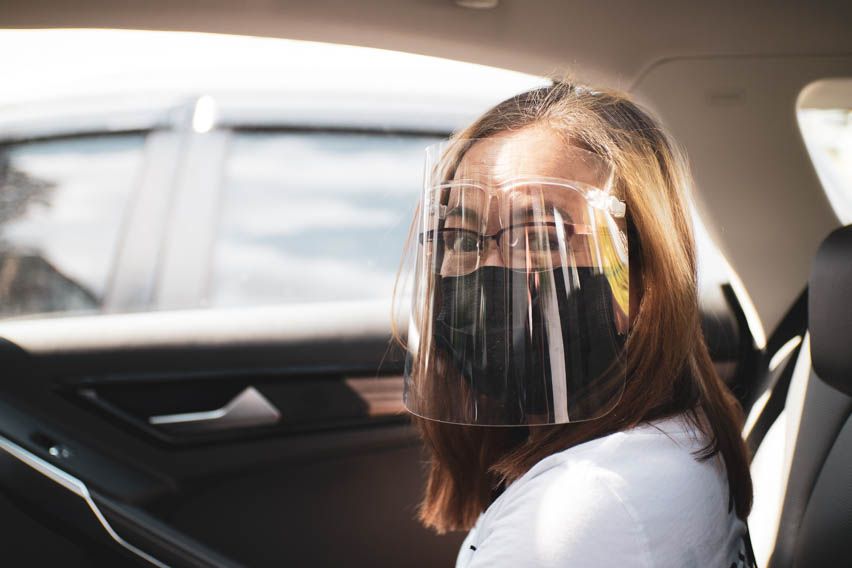 Mom Sitting with faceshield inside Ford Territory