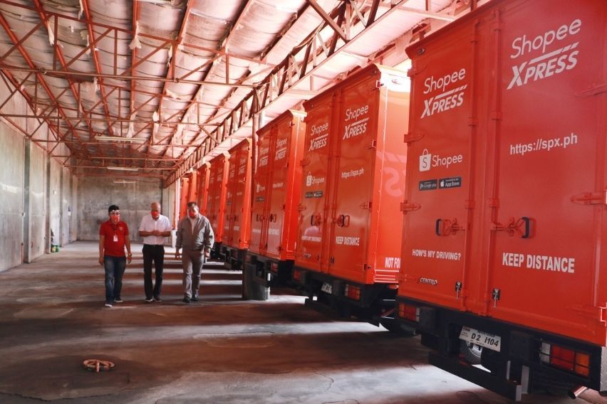 Shopee Xpress' Isuzu NMR85H Trucks