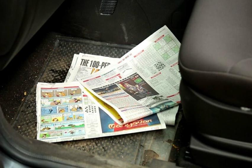 Monsoon car care tips: remove old newspapers
