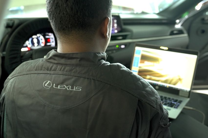 Lexus Accredited Dealership Technician on laptop