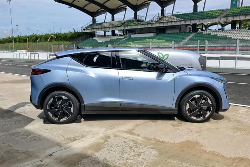 Perodua QV-E side profile view